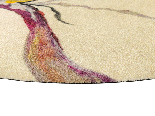 Eckansicht der runden Fußmatte in beige und abstrakem Muster