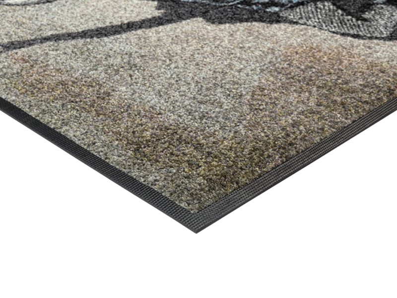 Eckansicht der Fußmatte mit Frau und Stern