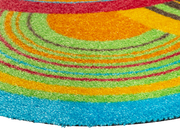 Eckansicht der Fußmatte in Sonderform mit bunten Kreisen