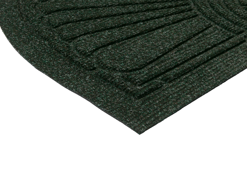 Eckansicht der Fußmatte für den Außenbereich in dunkelgrün mit 3D-Struktur