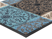 Eckansicht der Fußmatte mit runden Ornamenten und Blöcken