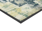 Eckansicht der Fußmatte mit blau, grünem abstraktem Muster