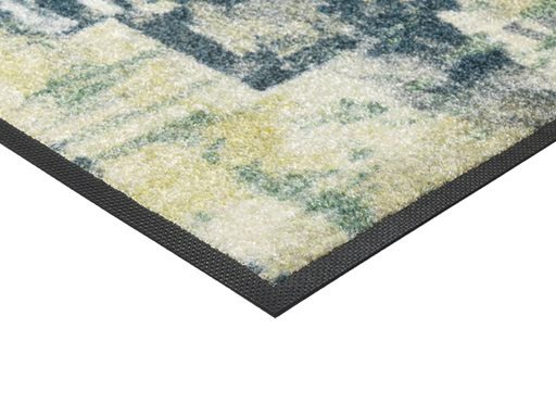 Eckansicht der Fußmatte mit blau, grünem abstraktem Muster