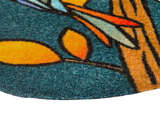Eckansicht der Fußmatte in blau mit Vogeln im Mosaik-Look
