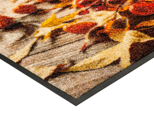 Eckansicht der Fußmatte mit herbstlichem Kürbismotiv