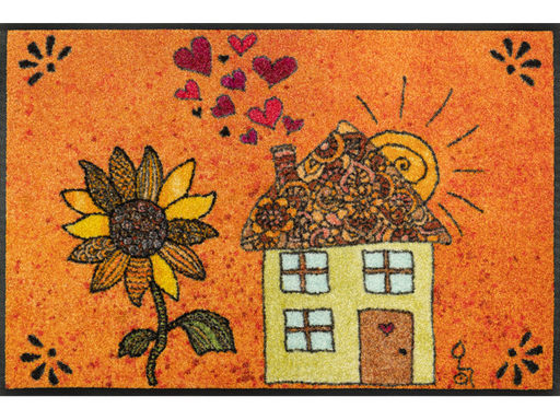 Fußmatte mit gezeichnetem Haus und einer großen Sonnenblume