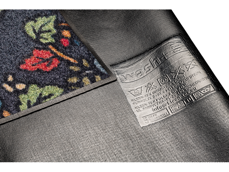 Rückenansicht der Fußmatte in grau mit buntem floralen Ornamenten