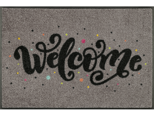 braune Fußmatte mit Schriftzug "Welcome" und bunten Punkten