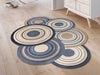 Fußmatte in Sonderform mit naturfarbenen Kreisen im Vorraum