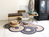 Fußmatte in Sonderform mit naturfarbenen Kreisen in der Garderobe