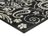 Eckansicht der Fußmatte schwarz mit weißem verschnörkeltem Blumenmuster
