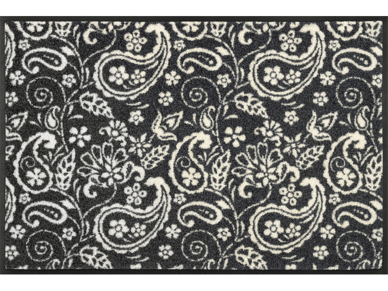 Fußmatte schwarz mit weißem verschnörkeltem Blumenmuster