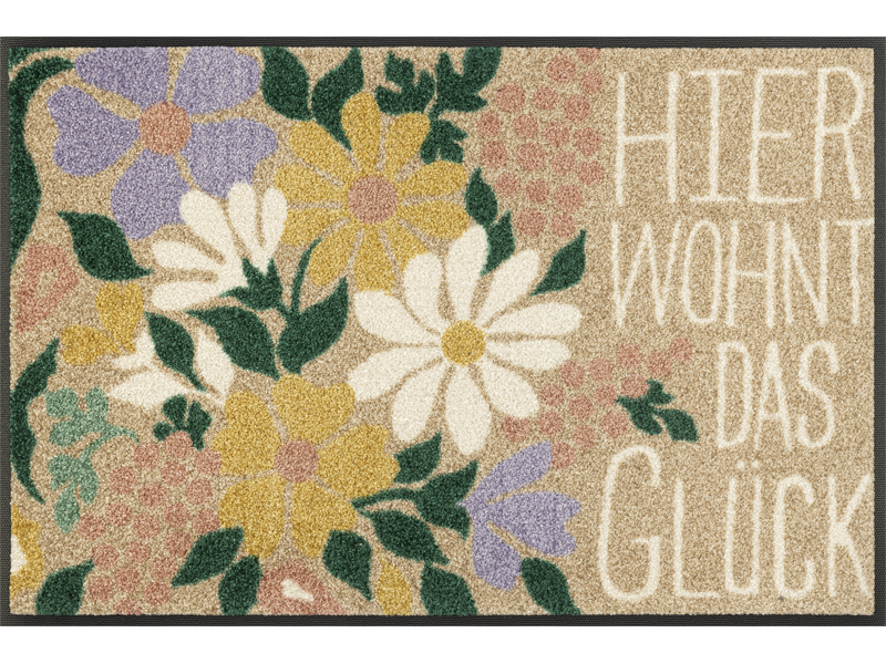 Fußmatte mit Blumen und Schriftzug "Hier wohnt das Glück"