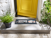 Fußmatte mit Wohnwagen vor der Haustür