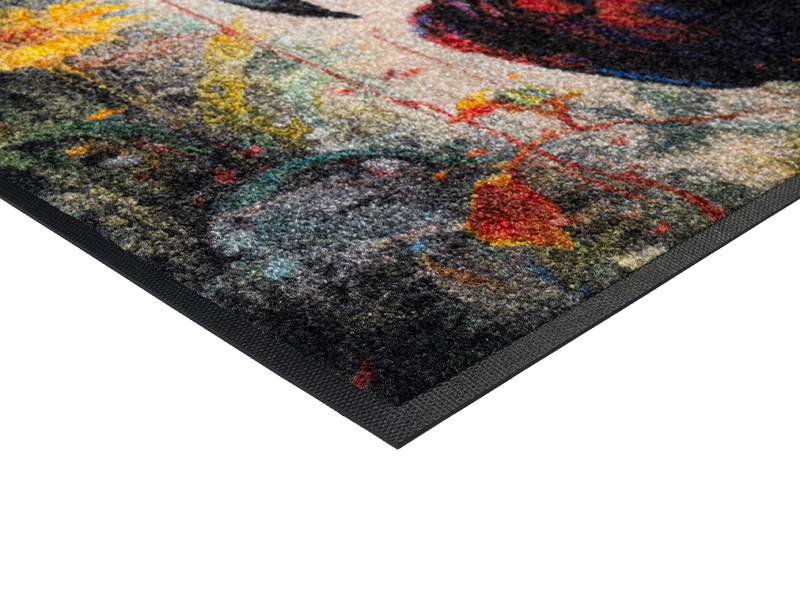 Eckansicht der Fußmatte mit Papagei und bunten Farben