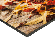 Eckansicht der Fußmatte mit herbstlichem Kürbismotiv