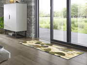 Fußmatte mit Fischreiher in Teichlandschaft vor der Terrassentür